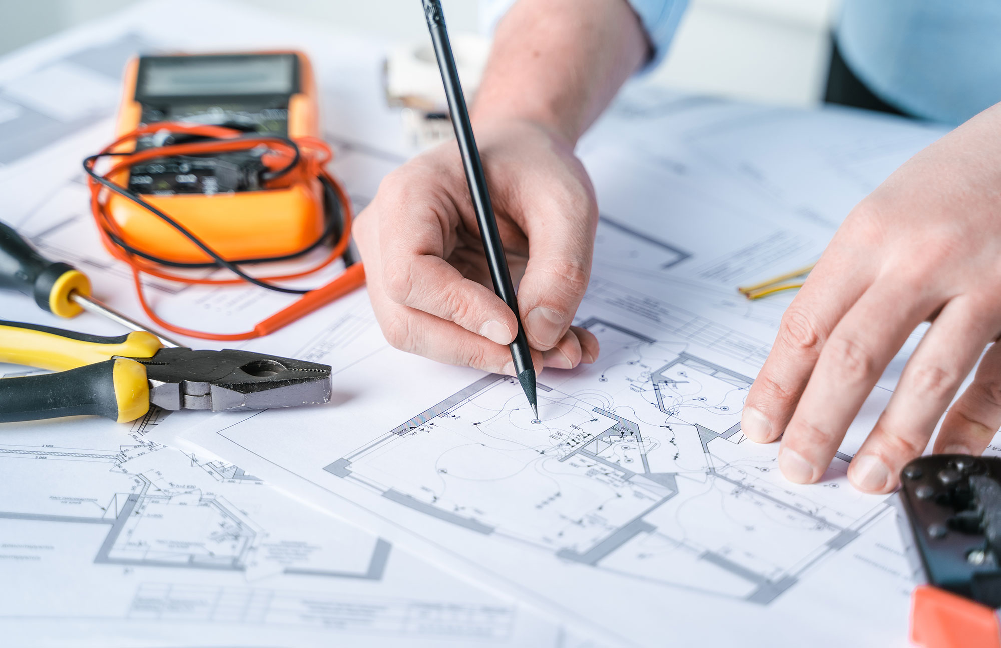 Licensed Nashville electrician carefully reviewing electrical floor plans for a local home wiring project